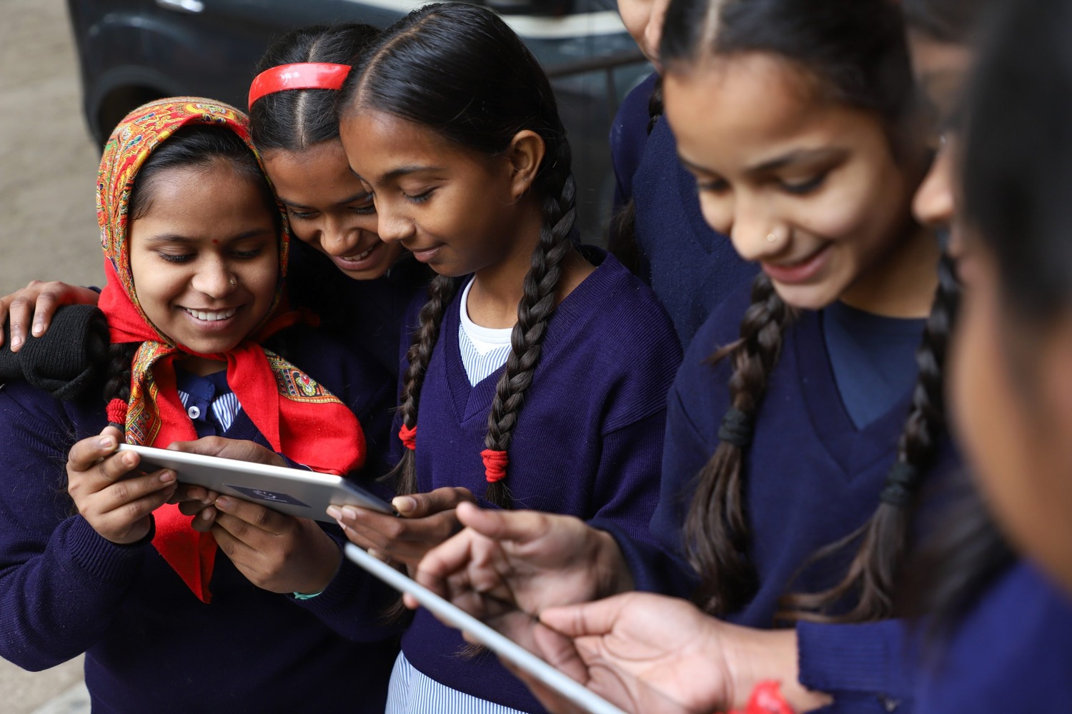 Children learning with tablets at Ashraya